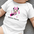 White baby onesie with Minnie Mouse, pink bow, and customizable "Babies Name".