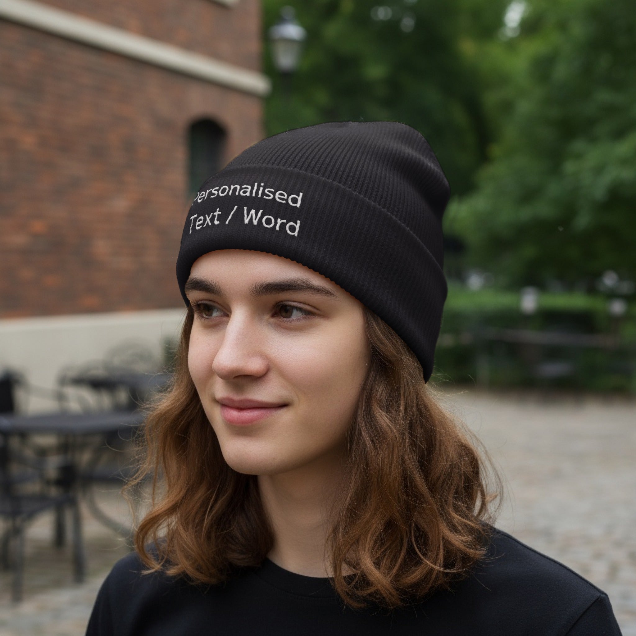 Black ribbed beanie with "Personalised Text / Word" embroidered in white.