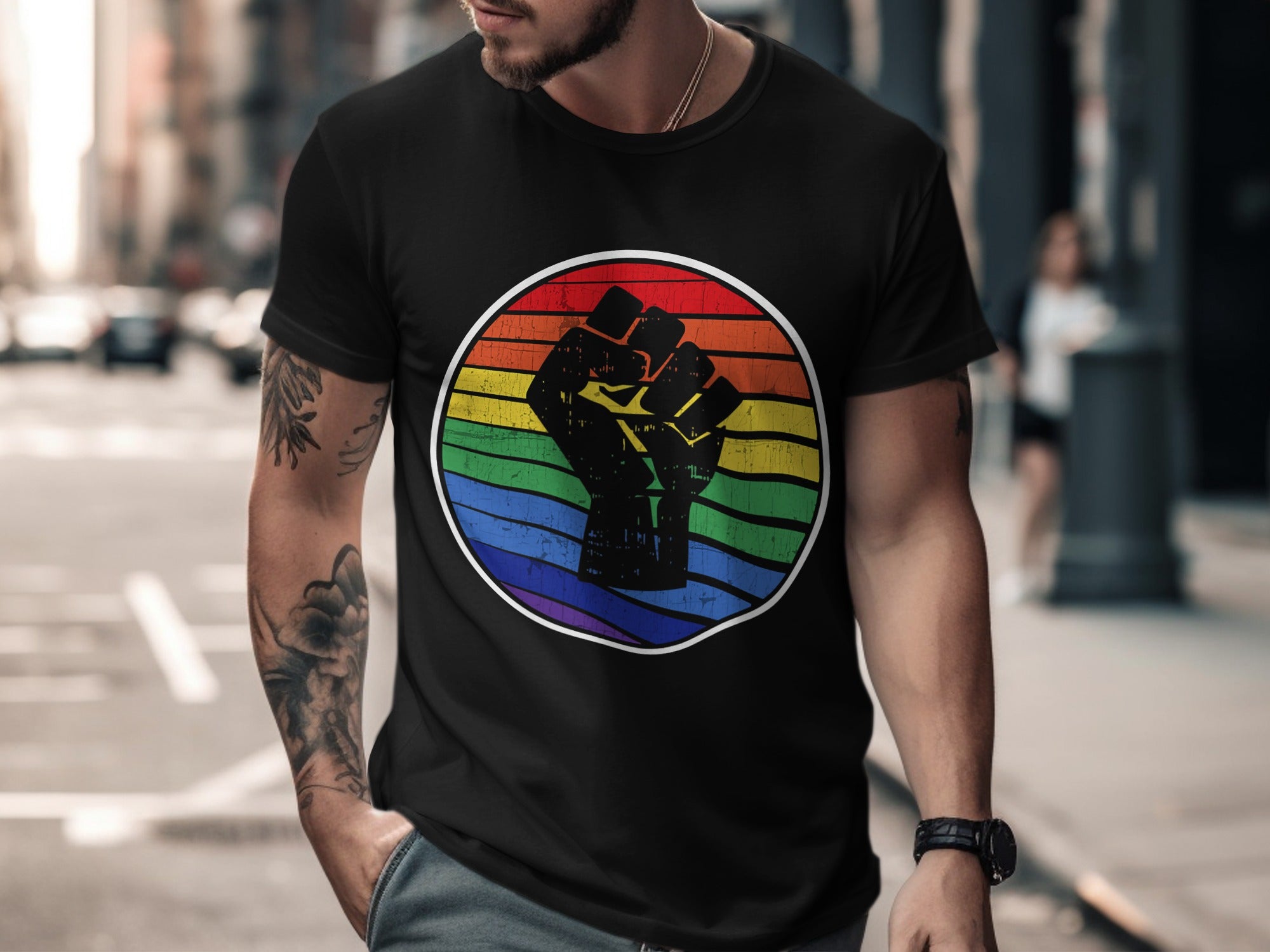 Black t-shirt with a raised fist symbol inside a rainbow circle.