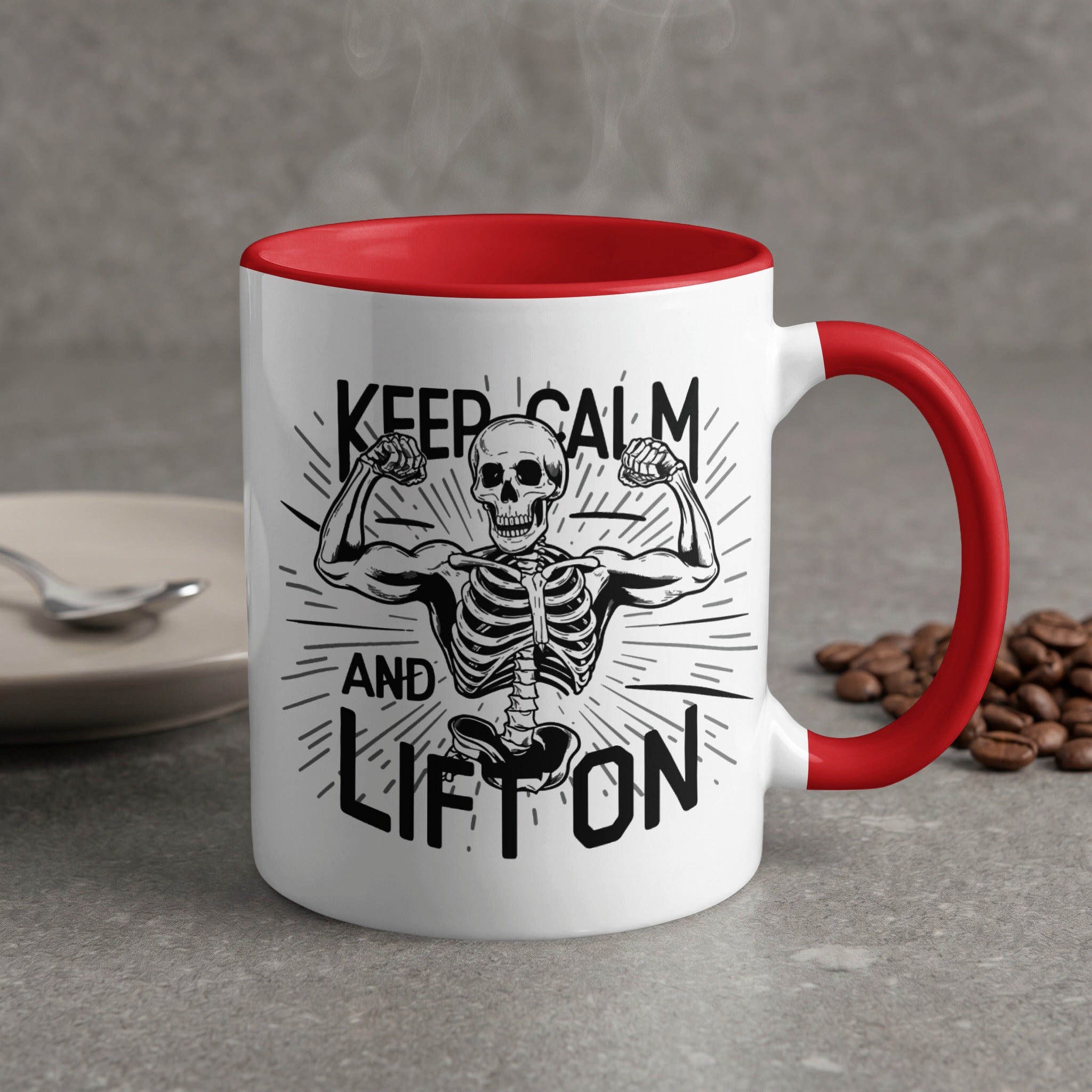 White mug with red handle, featuring a skeleton flexing and text "Keep Calm and Lift On".