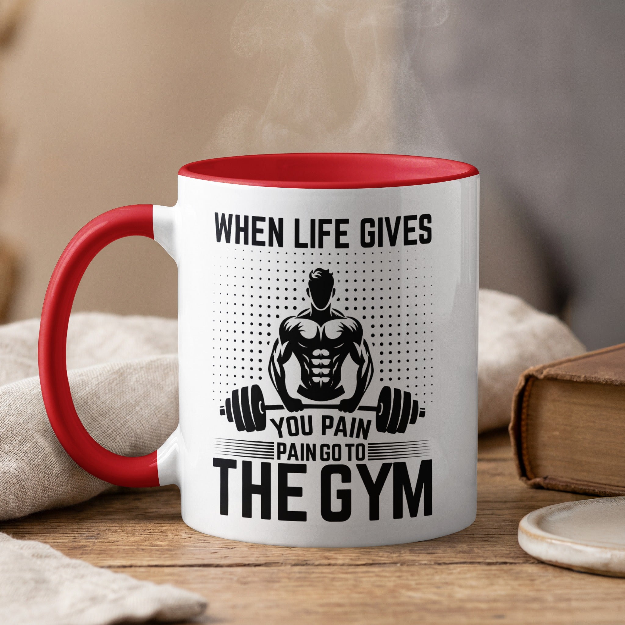 White mug with red handle, featuring text and muscular man.