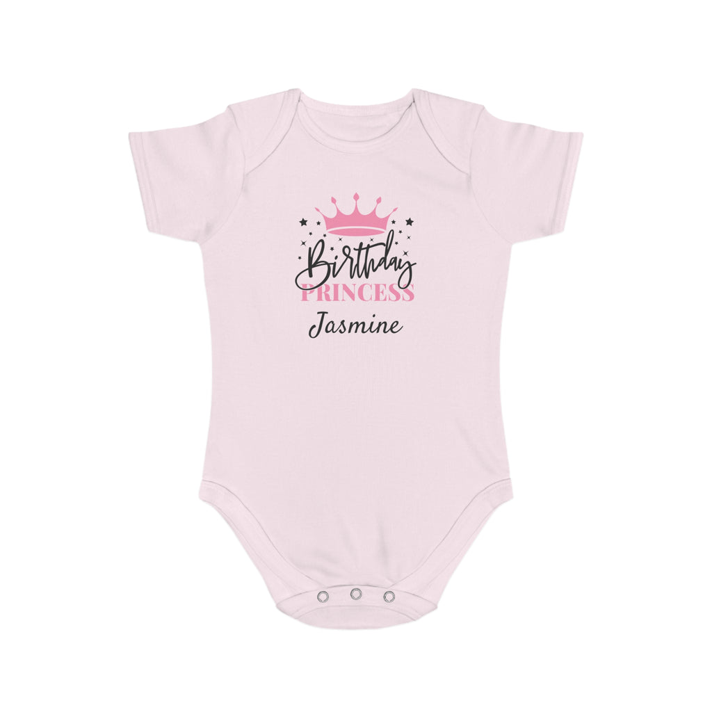 Light pink baby onesie with "Birthday Princess Jasmine" text and crown graphic.