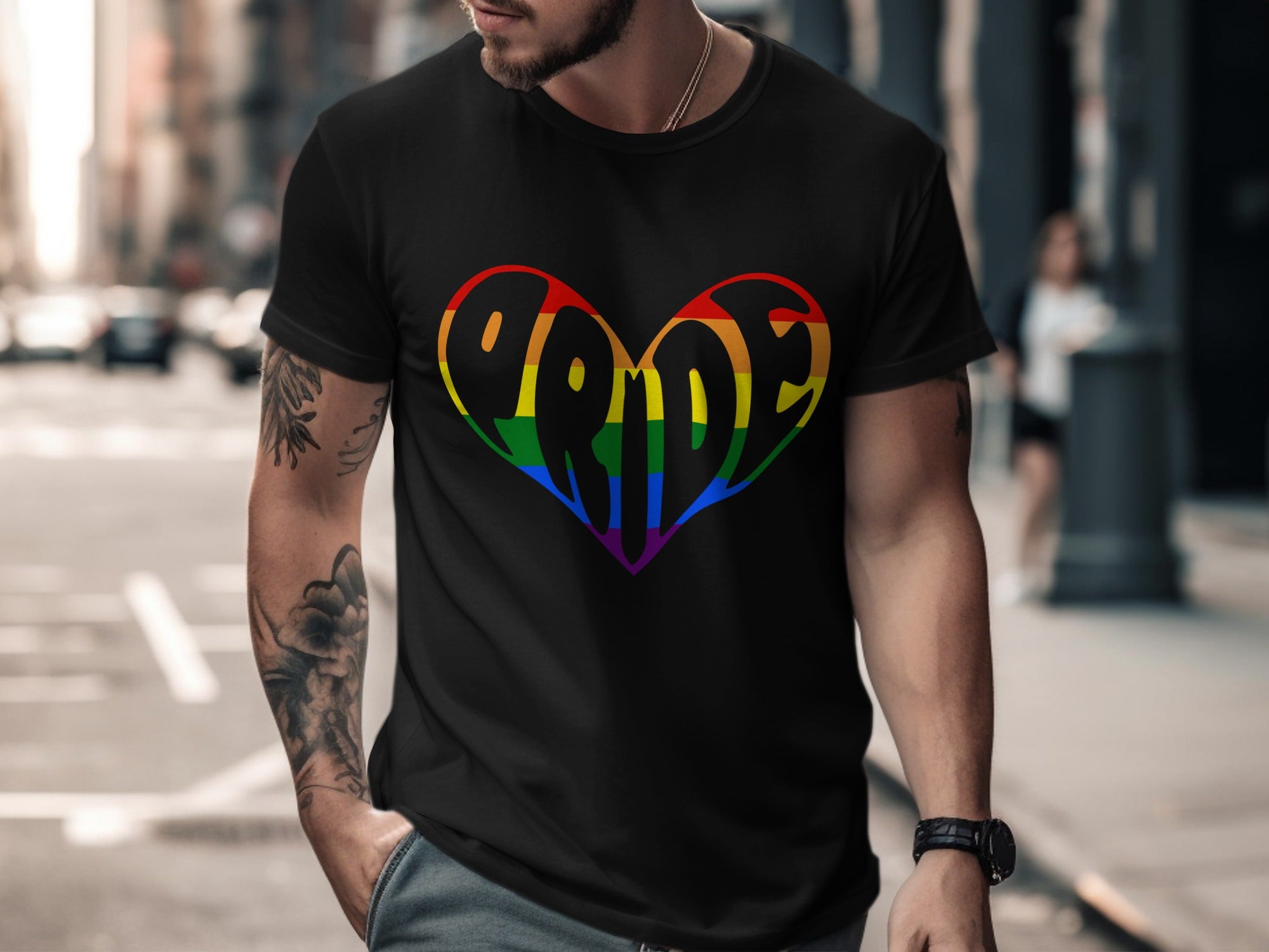 Black t-shirt with colorful rainbow pride heart graphic on chest.