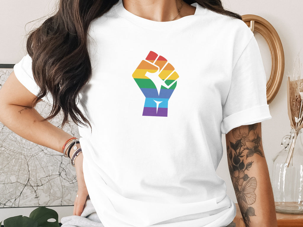 White t-shirt with a rainbow raised fist graphic on the front.