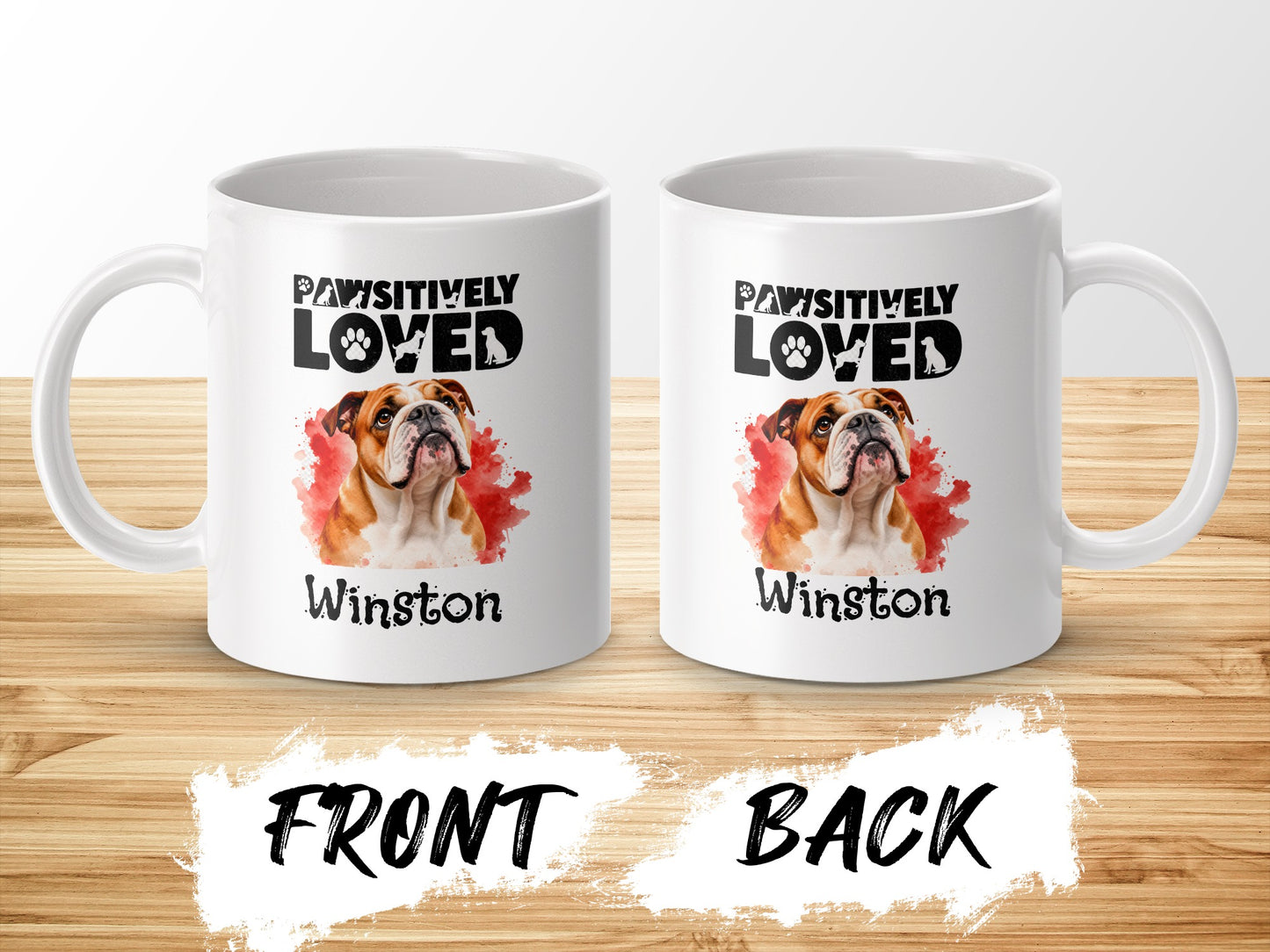 Two white mugs each featuring a bulldog graphic with text "PAWSITIVELY LOVED Winston."