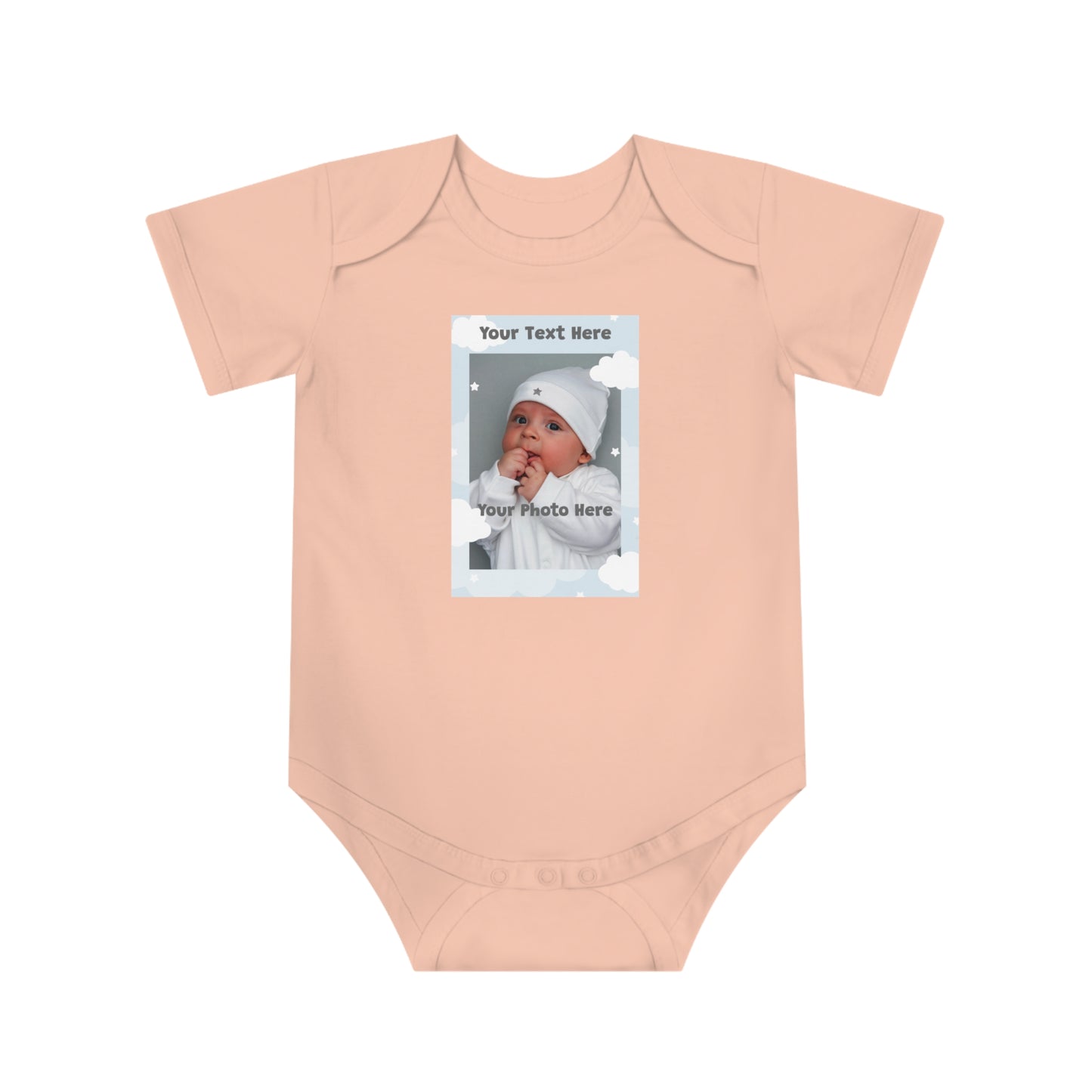 Peach newborn onesie with customizable photo frame featuring text "Your Text Here"