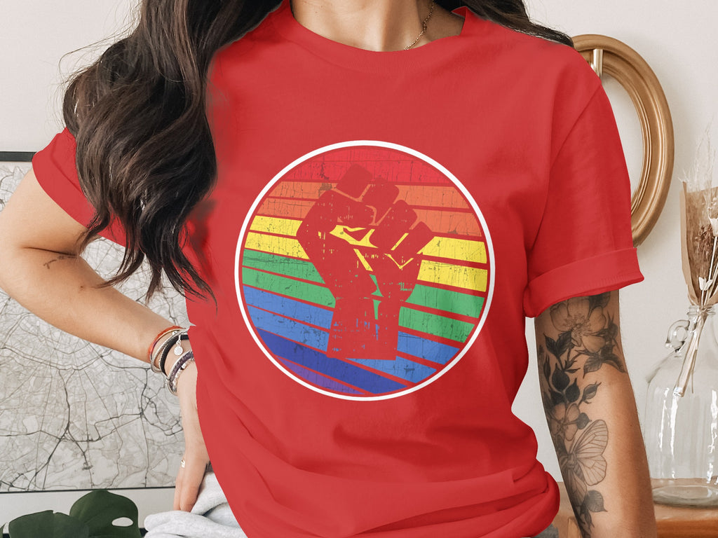 Red t-shirt with a vintage rainbow circle and raised fist graphic.