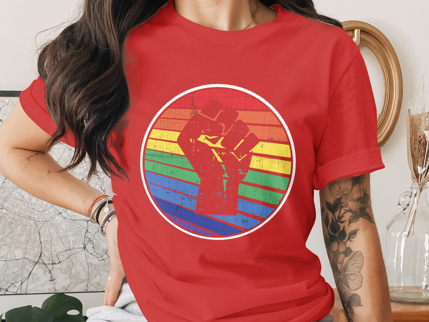 Red t-shirt with a vintage rainbow circle and raised fist graphic.