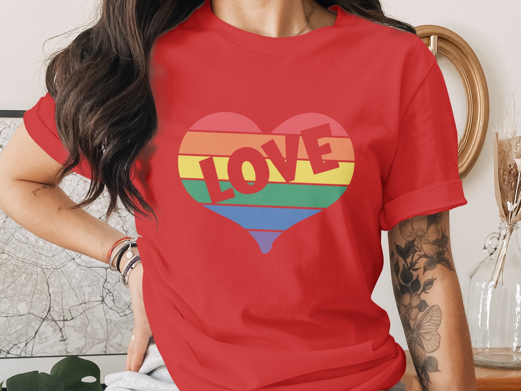 Red t-shirt with a rainbow heart graphic and the word "LOVE" in bold letters.