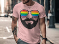 Pink t-shirt with illustration of a face wearing rainbow sunglasses and a beard.