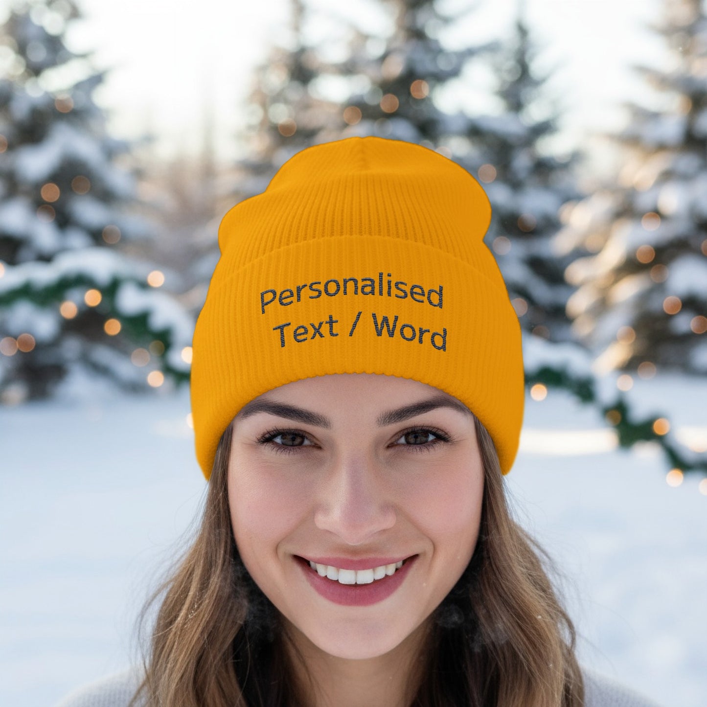 Yellow beanie with "Personalised Text / Word" on the front, worn by a woman.