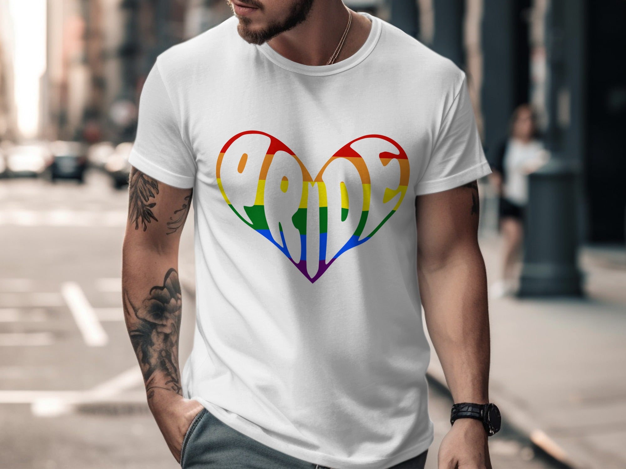 White t-shirt with a rainbow heart graphic that spells "Pride".