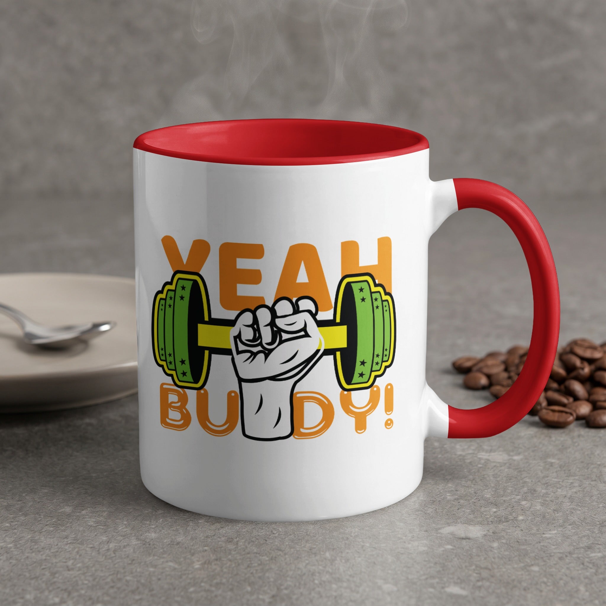 White mug with red handle, text "YEAH BUDDY!" and dumbbell graphic.