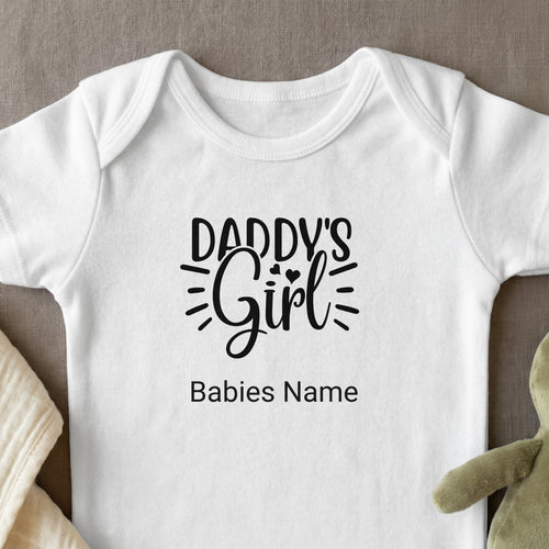 White baby onesie with "Daddy's Girl" and "Babies Name" text.