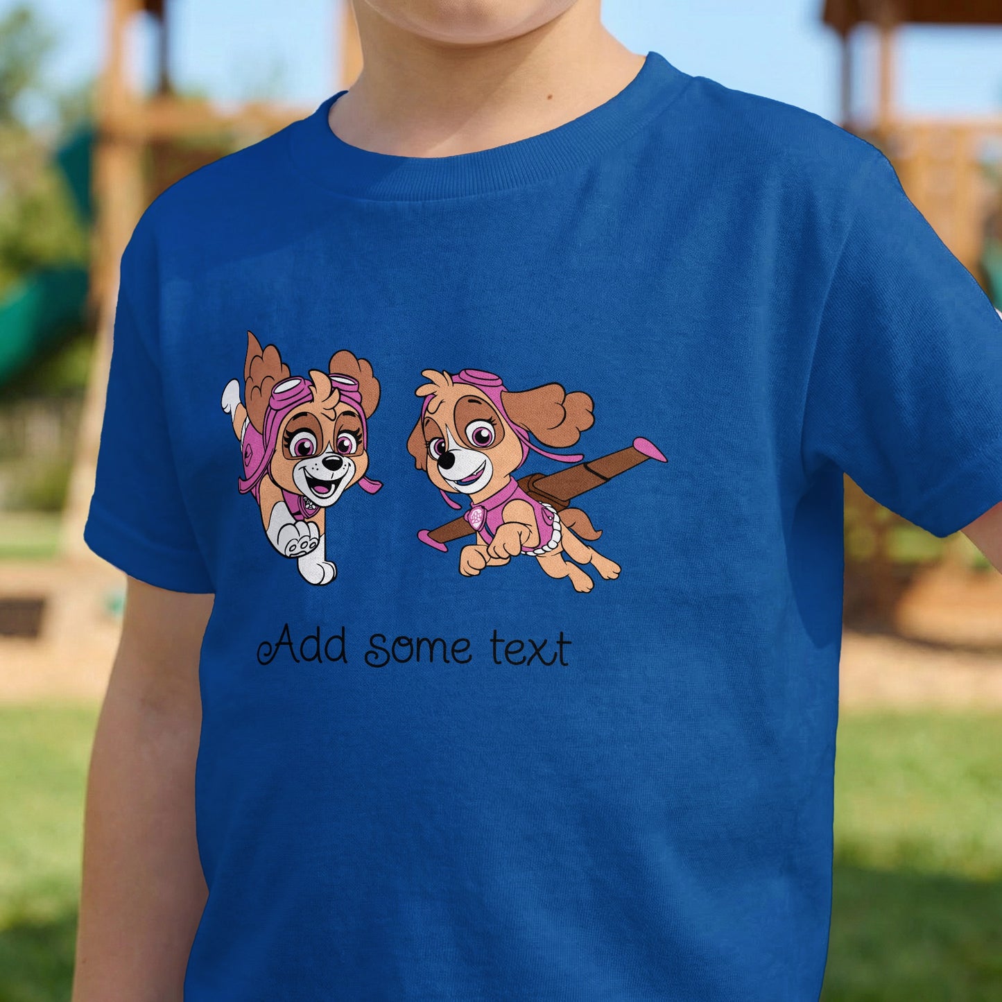 Blue t-shirt with cartoon Skye from Paw Patrol in flight gear and text "Add some text".
