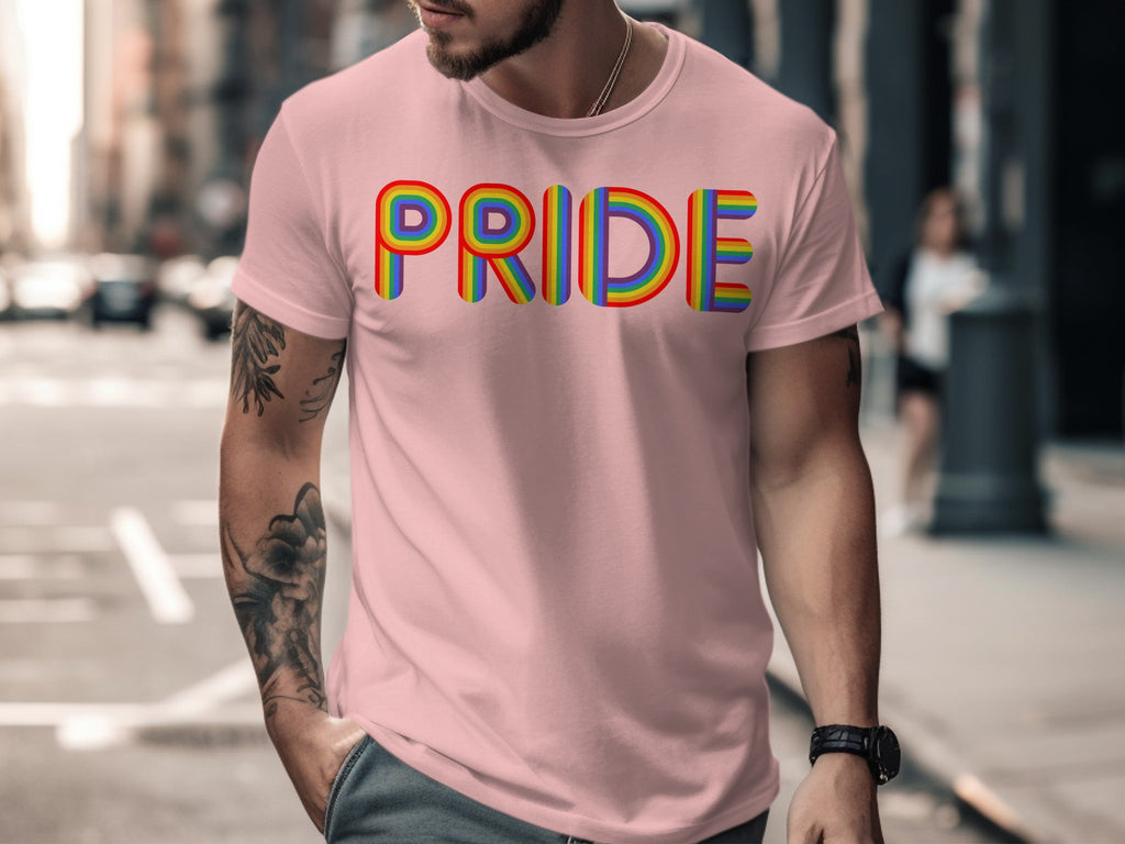 Pink t-shirt with rainbow-colored "PRIDE" text graphic, worn by a man.
