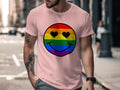 Pink t-shirt with rainbow smiley face design featuring heart eyes.