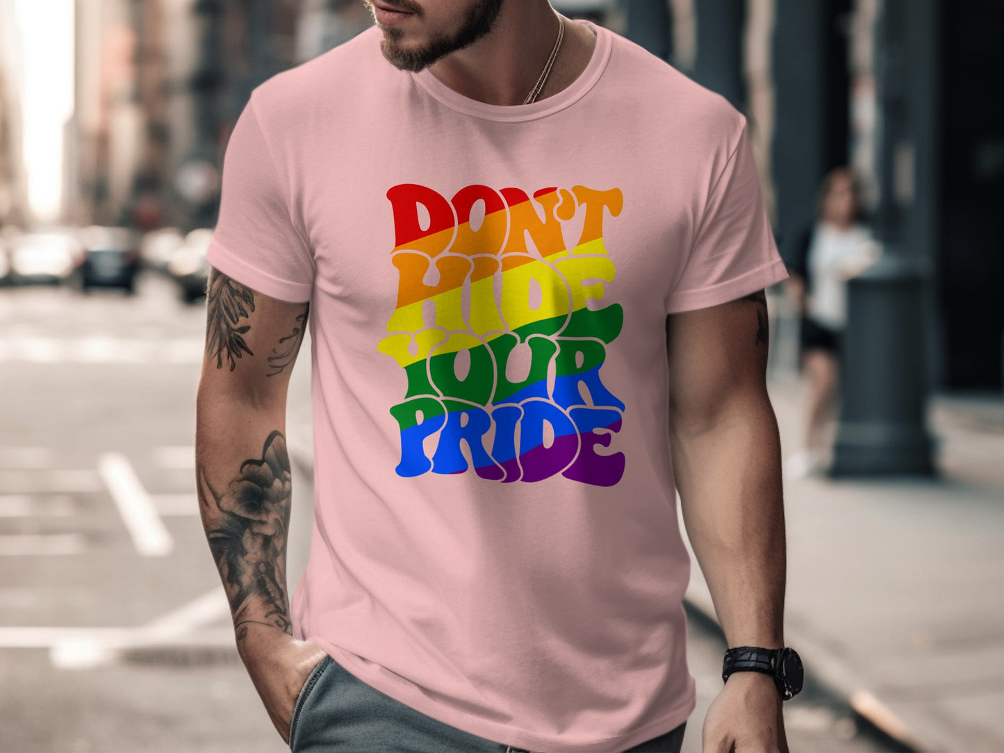 Pink t-shirt with rainbow text "Don't Hide Your Pride."
