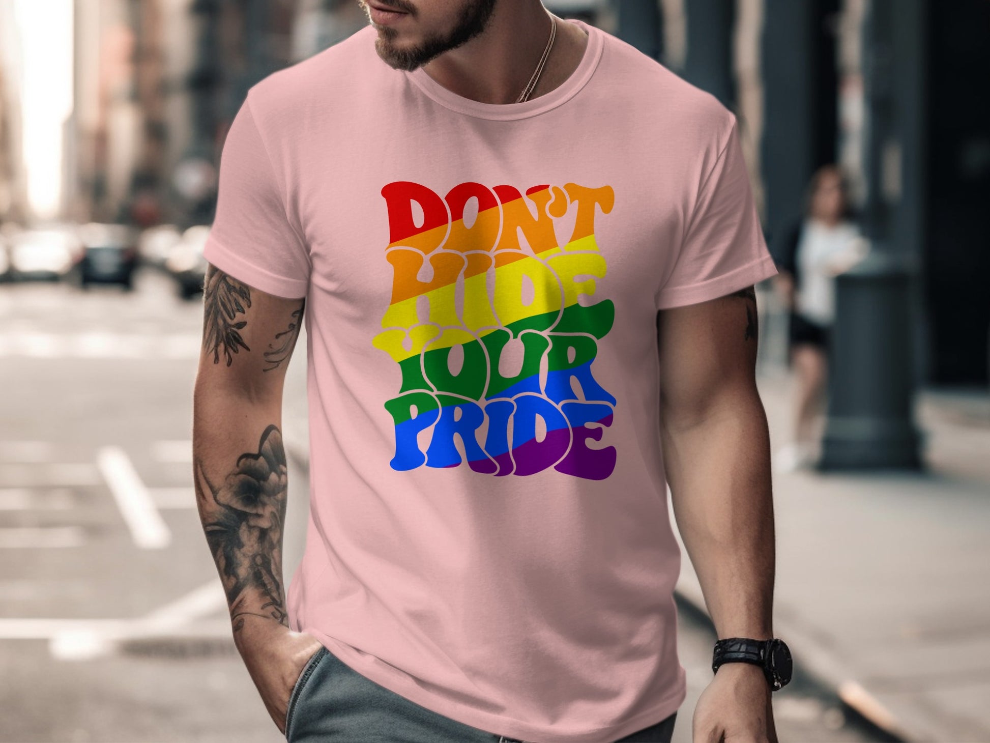 Pink t-shirt with rainbow text "Don't Hide Your Pride."