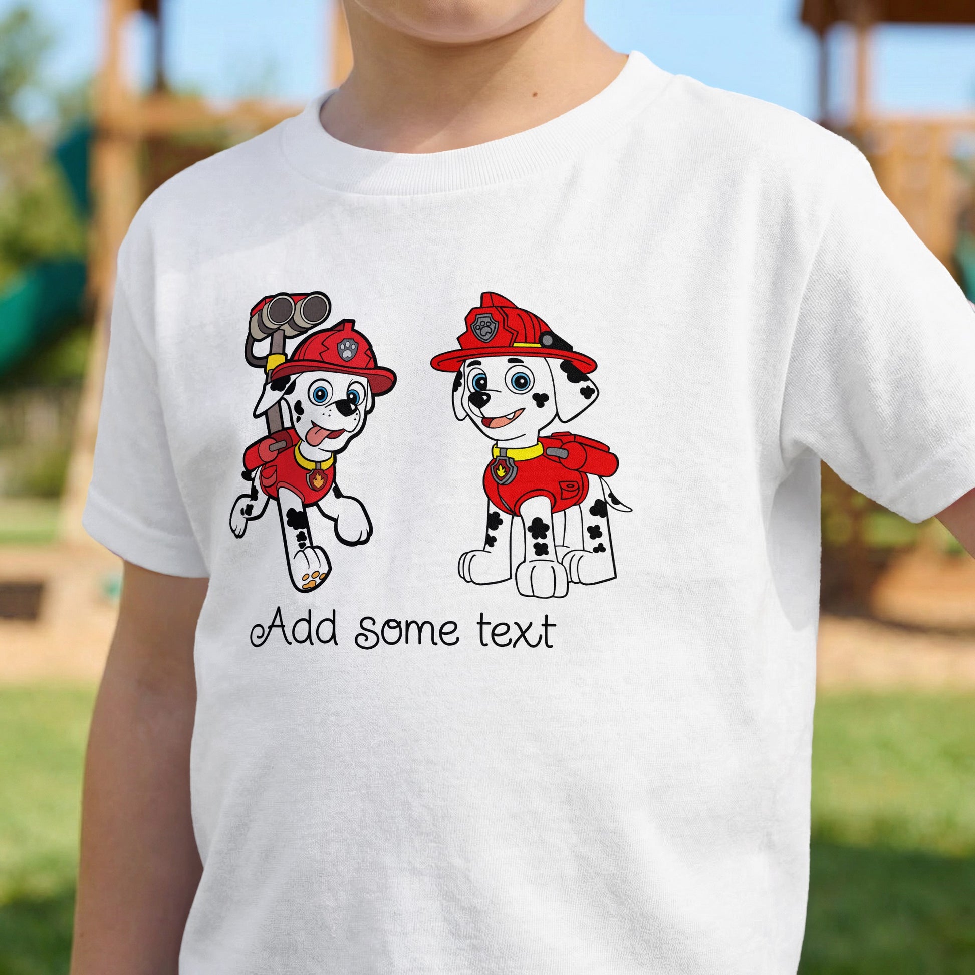 White t-shirt with cartoon dogs wearing firefighter hats and vests, and text.