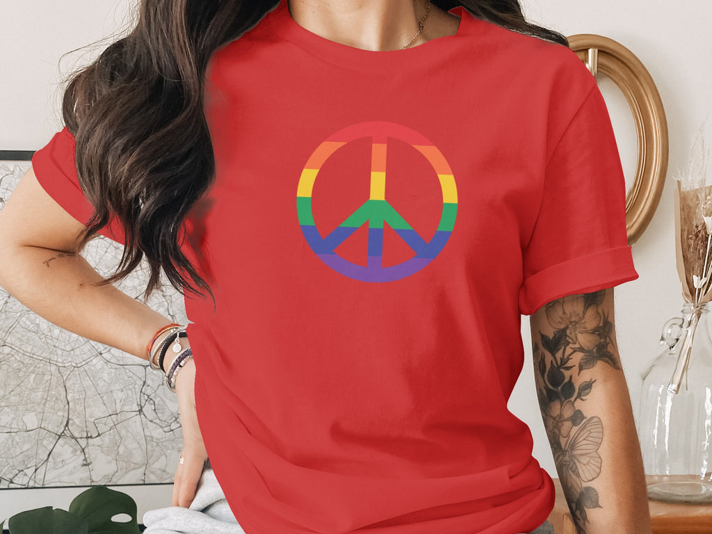 Red t-shirt with rainbow peace sign on chest.