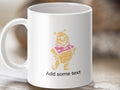 White mug with Pooh Bear shape made of "Pooh" and "Winnie" text.