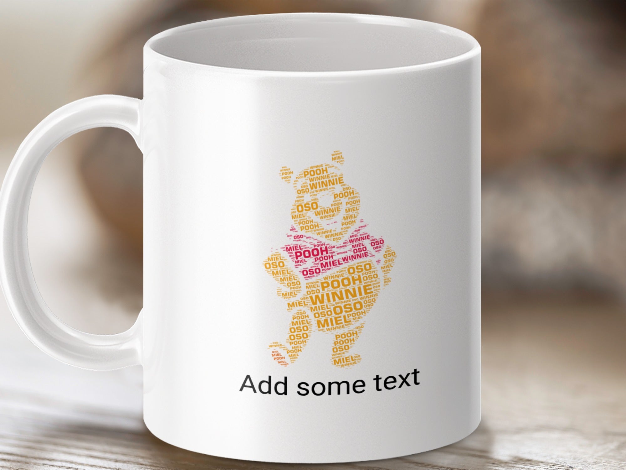 White mug with Pooh Bear shape made of "Pooh" and "Winnie" text.