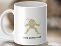 White mug with Teenage Mutant Ninja Turtle formed by text, "Add some text" below.