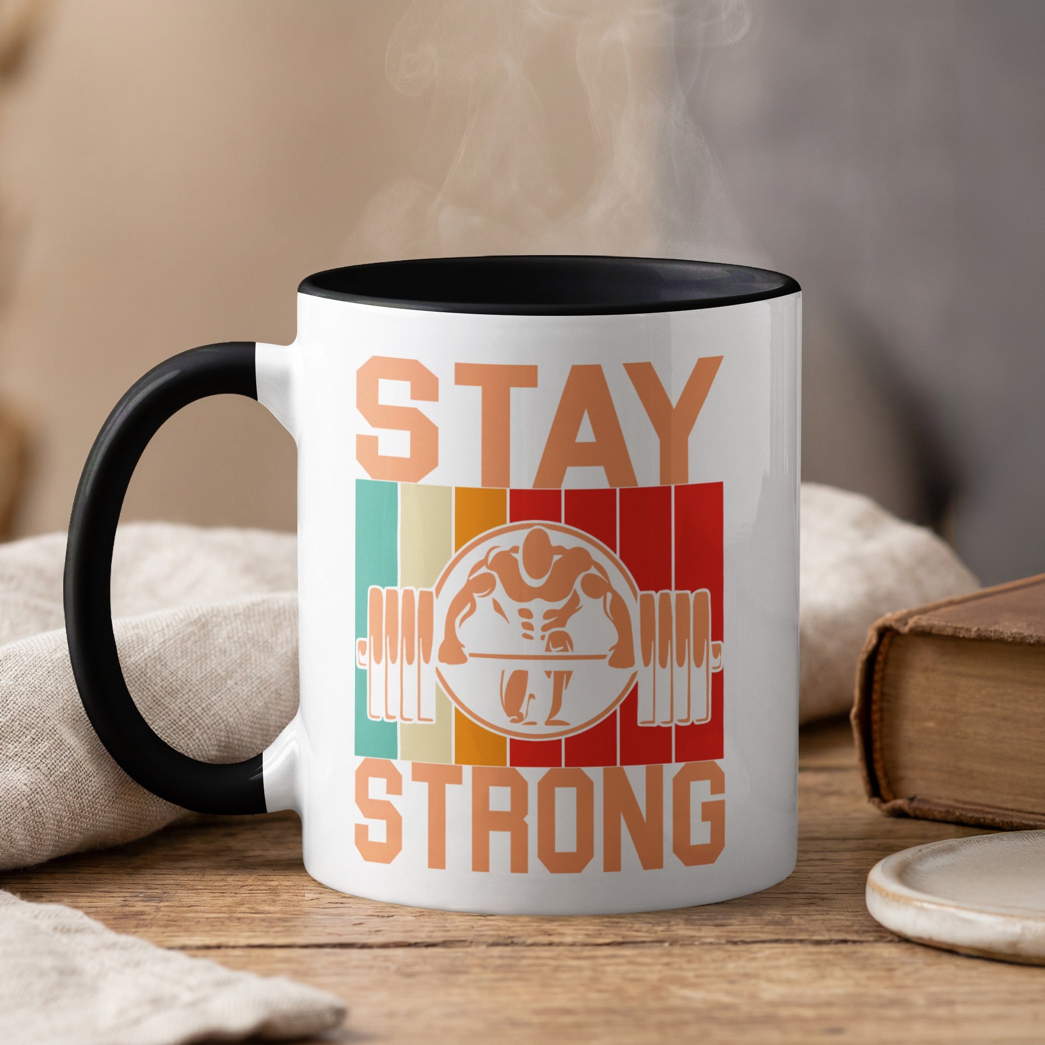 Mug with "Stay Strong" text, barbell, and stylized figure.
