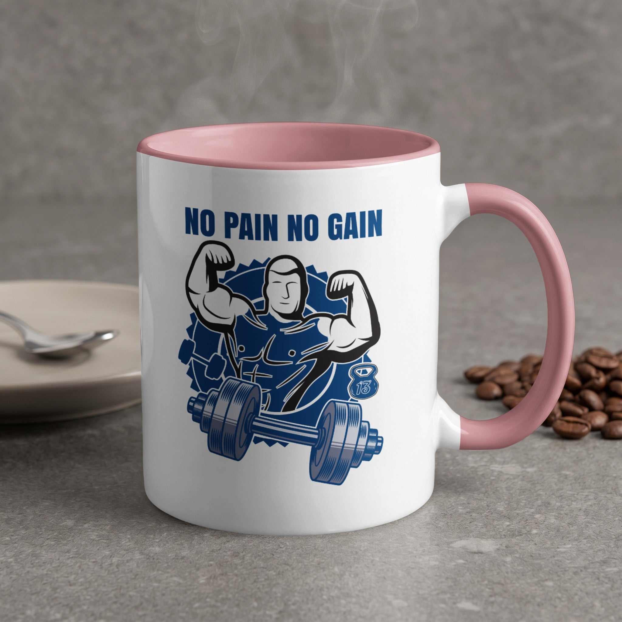 White mug with "NO PAIN NO GAIN" text and muscular figure.