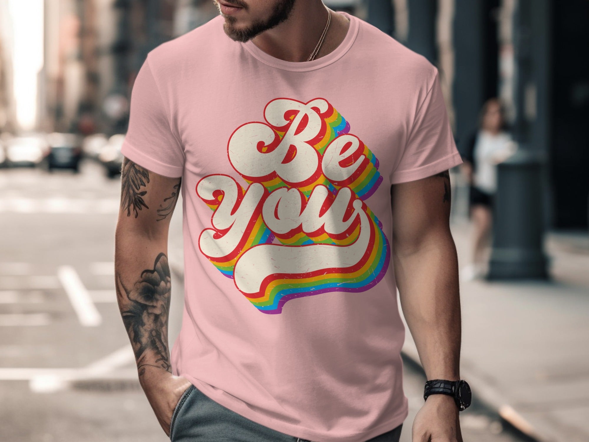 Pink t-shirt with "Be You" in rainbow retro script