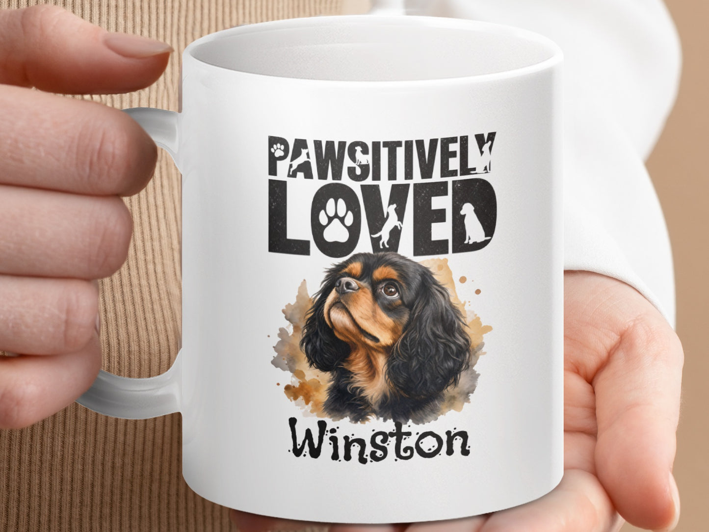 White mug with dog art featuring "Pawsitively Loved" and "Winston."