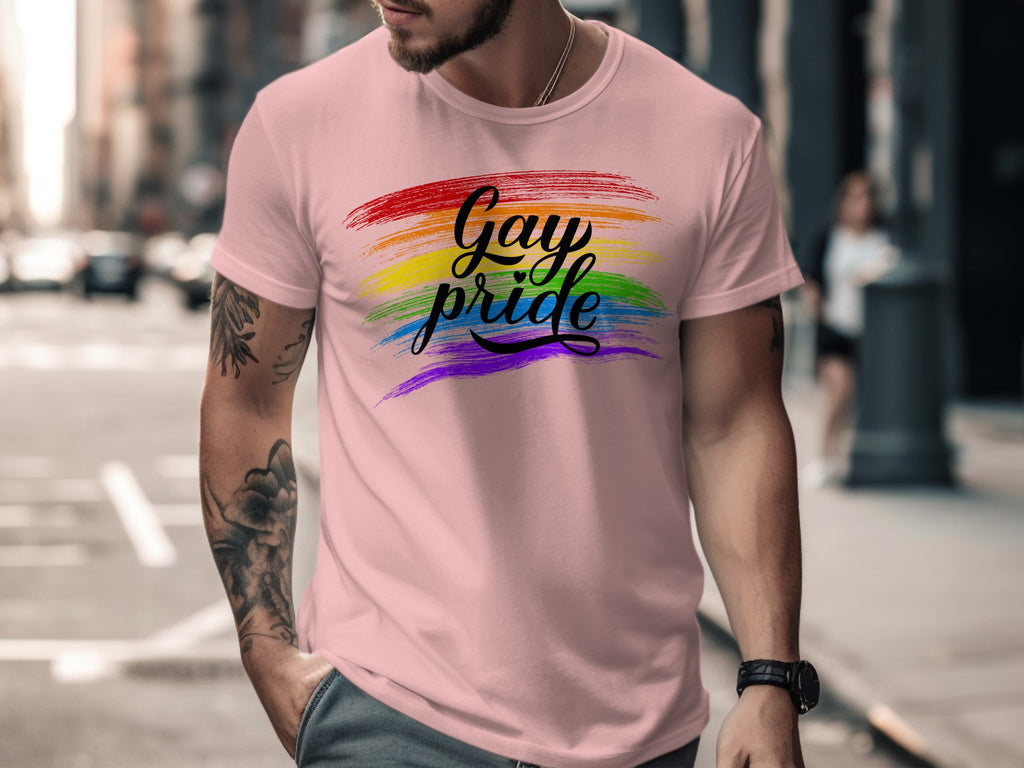 Pink t-shirt with "Gay pride" in calligraphy over a rainbow stripe.