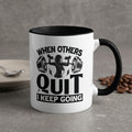 White mug with black rim, featuring workout graphic and motivational text.