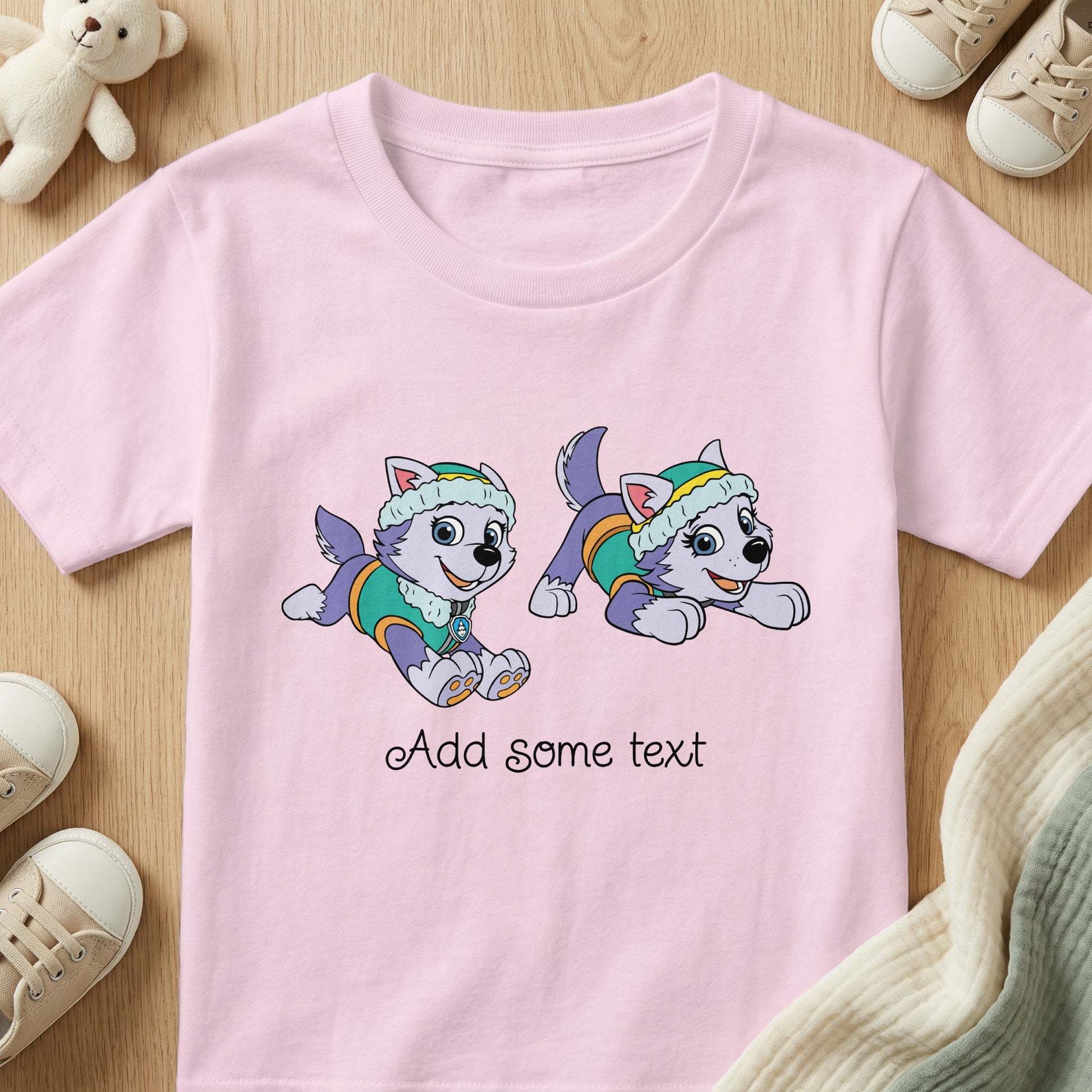 Pink t-shirt with two cartoon huskies and script text that says "Add some text".