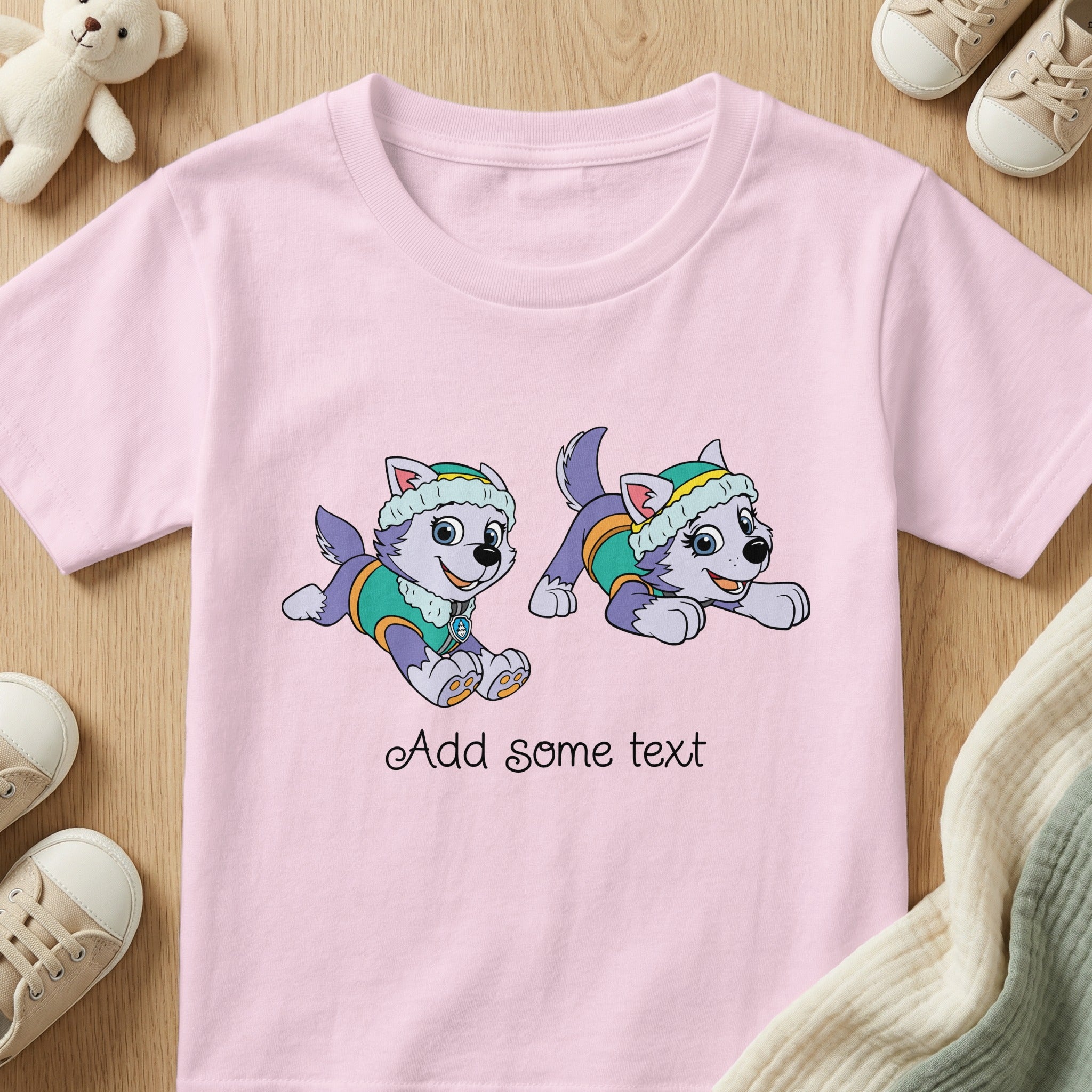 Pink t-shirt with two cartoon huskies and script text that says "Add some text".