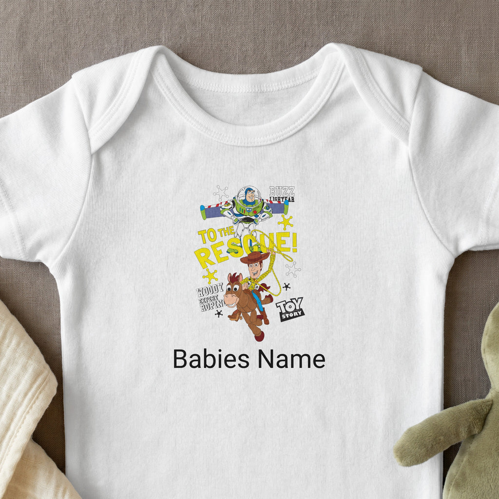 White baby onesie with "Toy Story: To the Rescue!" graphic and "Babies Name" text.