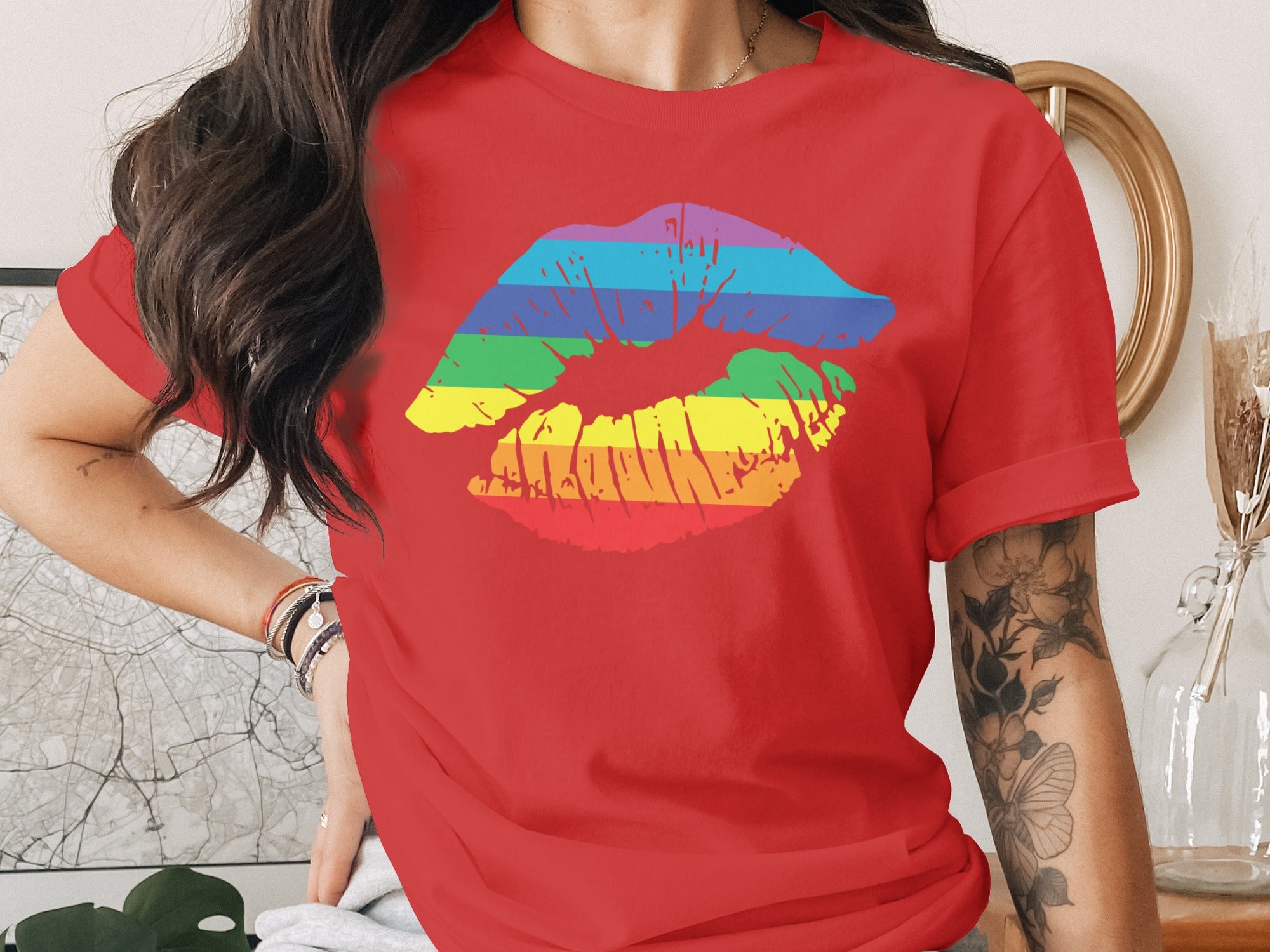 Red t-shirt with a rainbow-striped kiss imprint graphic across the chest.