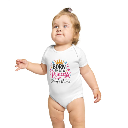 Baby in white bodysuit with "Born to be a Princess" text and crown.