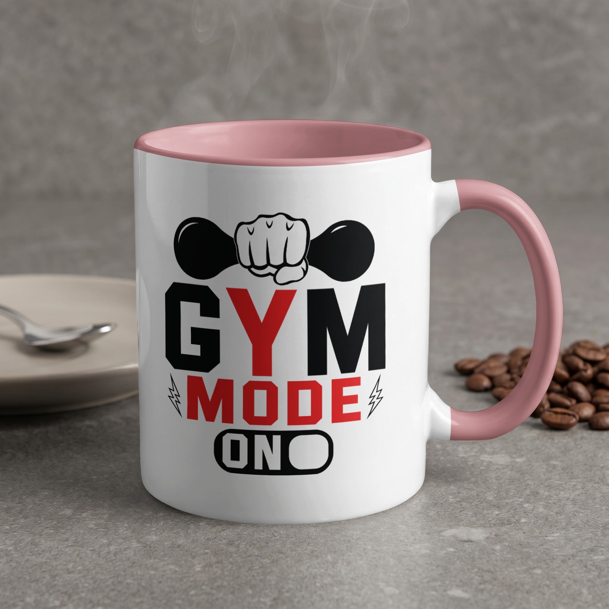 White mug with pink handle and text "GYM MODE ON".