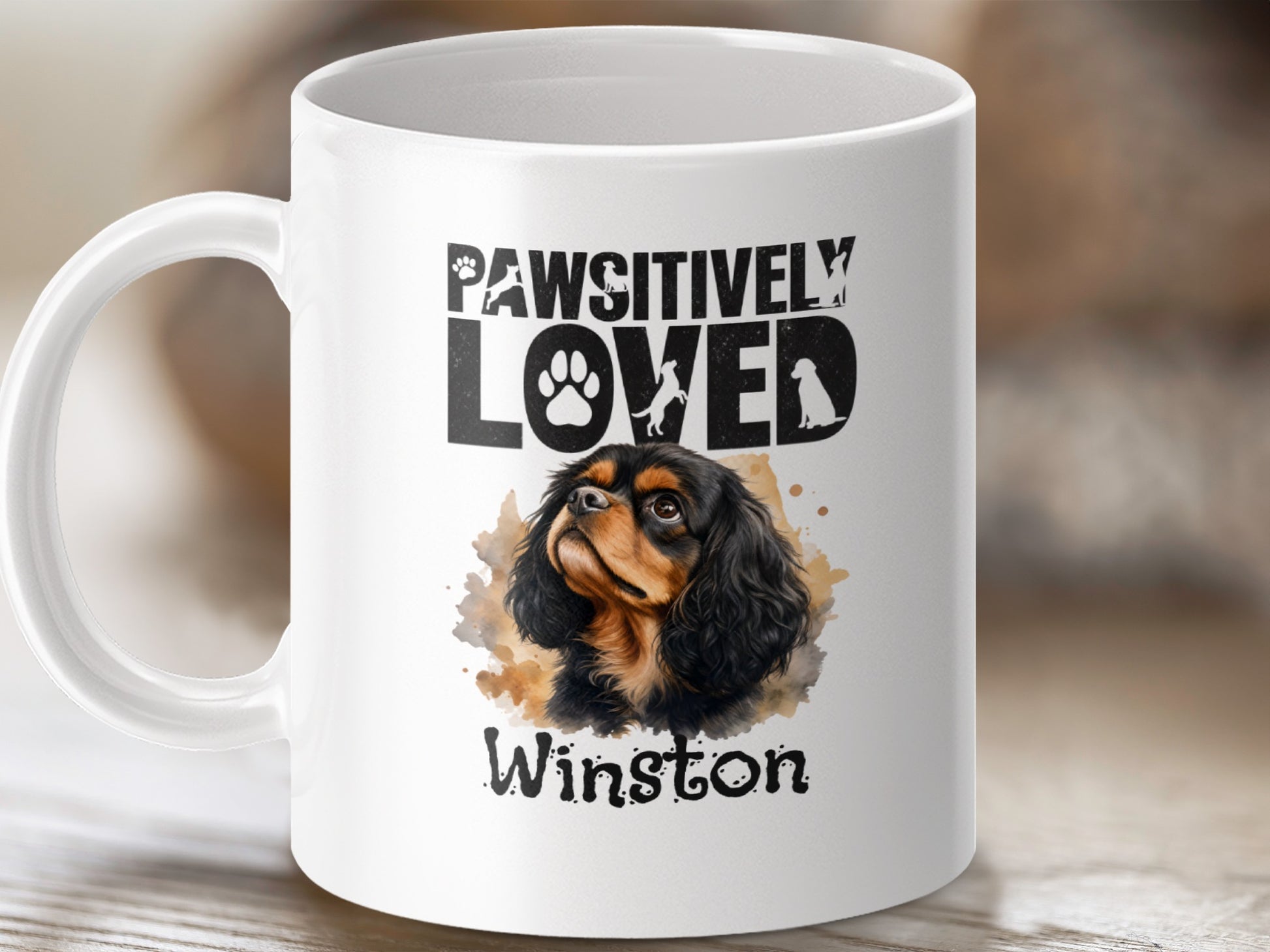 Mug with "Pawsitively Loved Winston" and a portrait of a Cavalier King Charles Spaniel.