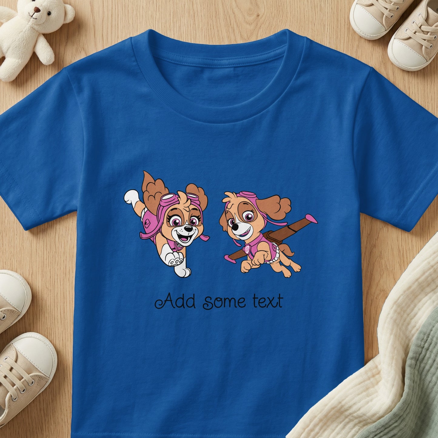 Blue t-shirt with cartoon dogs and "Add some text" slogan.