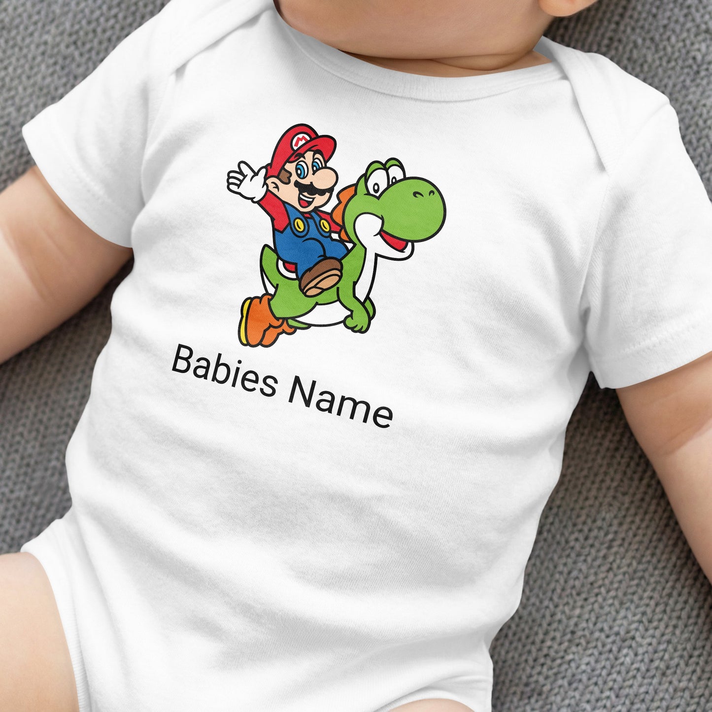 Baby onesie with Mario riding Yoshi, featuring "Babies Name" text.