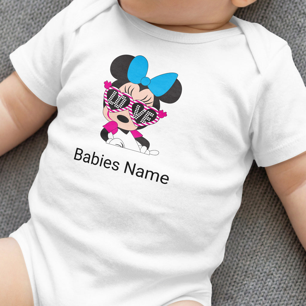 White baby onesie with Minnie Mouse graphic wearing sunglasses and "Babies Name" text.