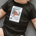 Customizable black baby onesie with photo frame mockup and text.