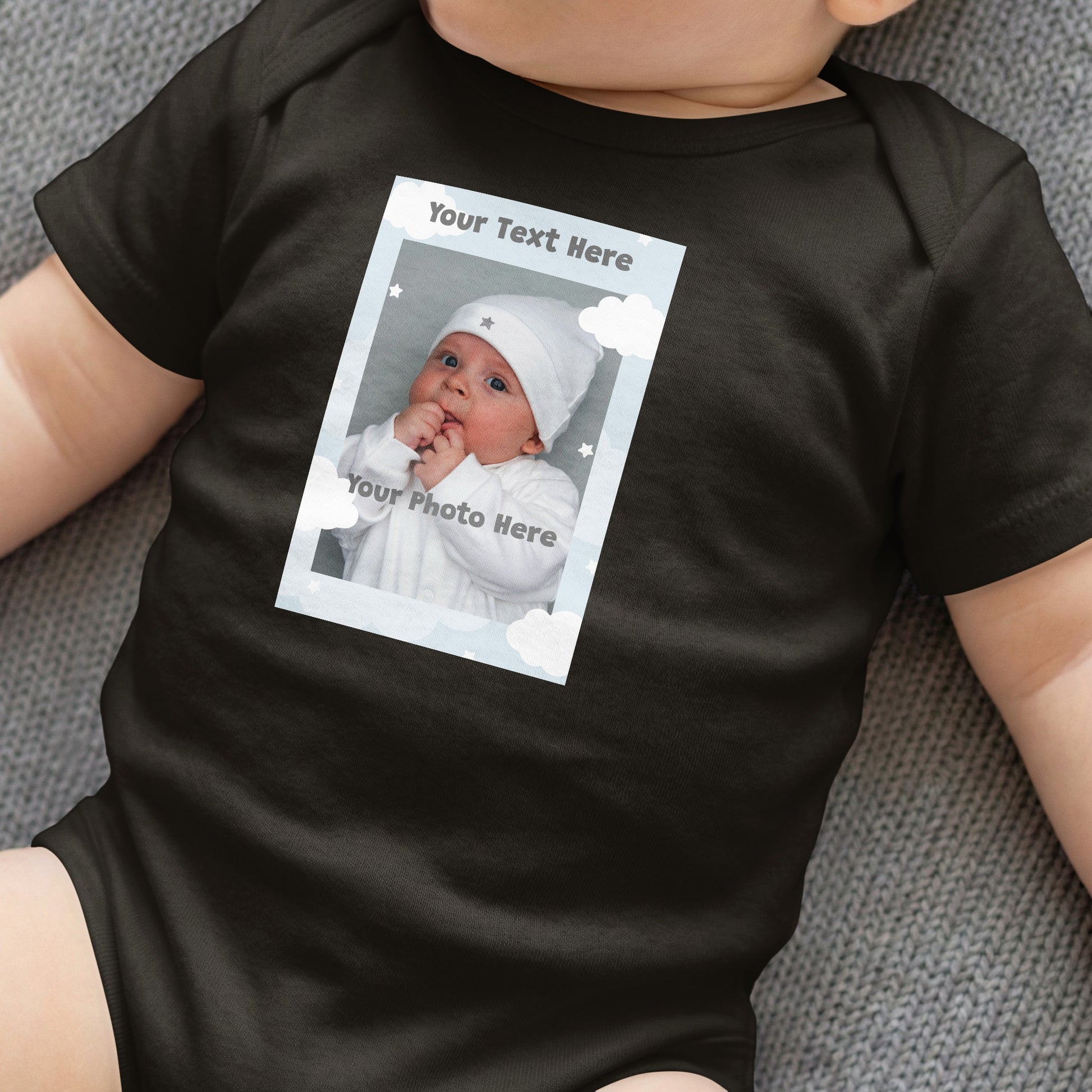 Customizable black baby onesie with photo frame mockup and text.