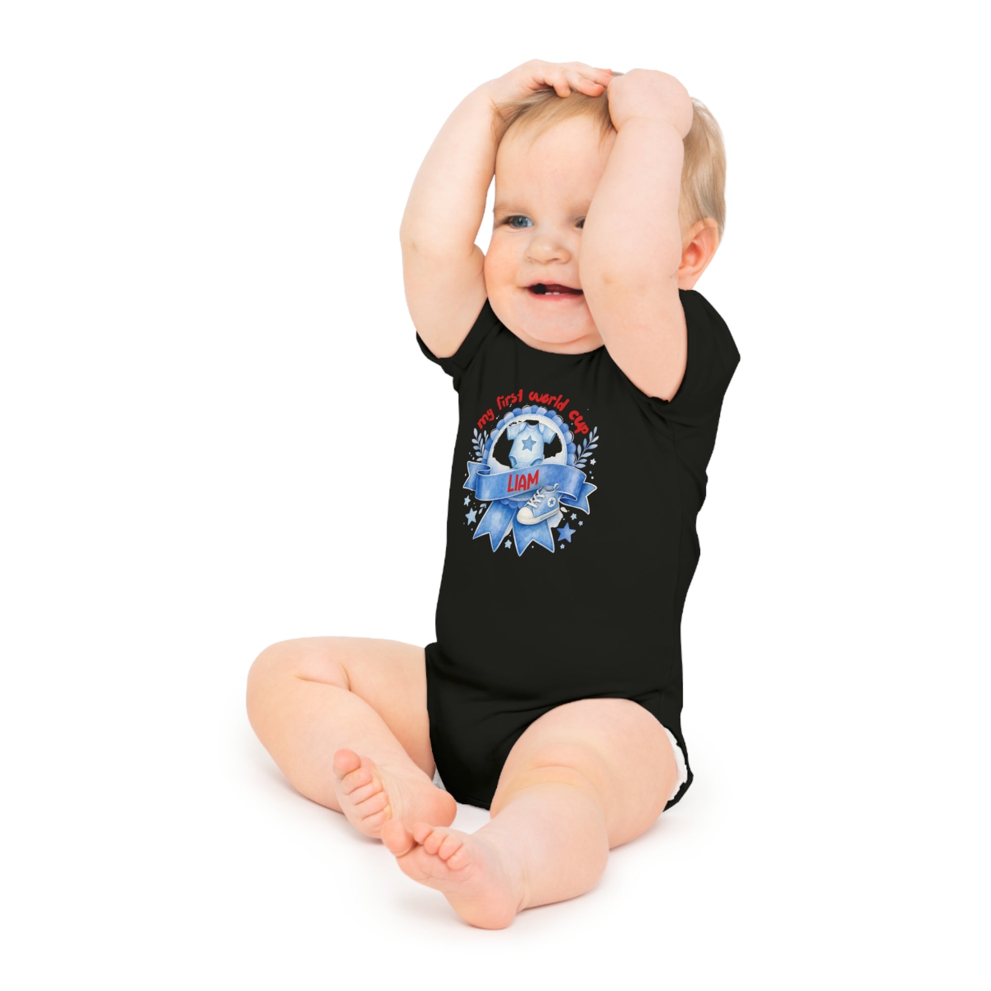 Black baby onesie with "my first world cup" text and a football graphic.