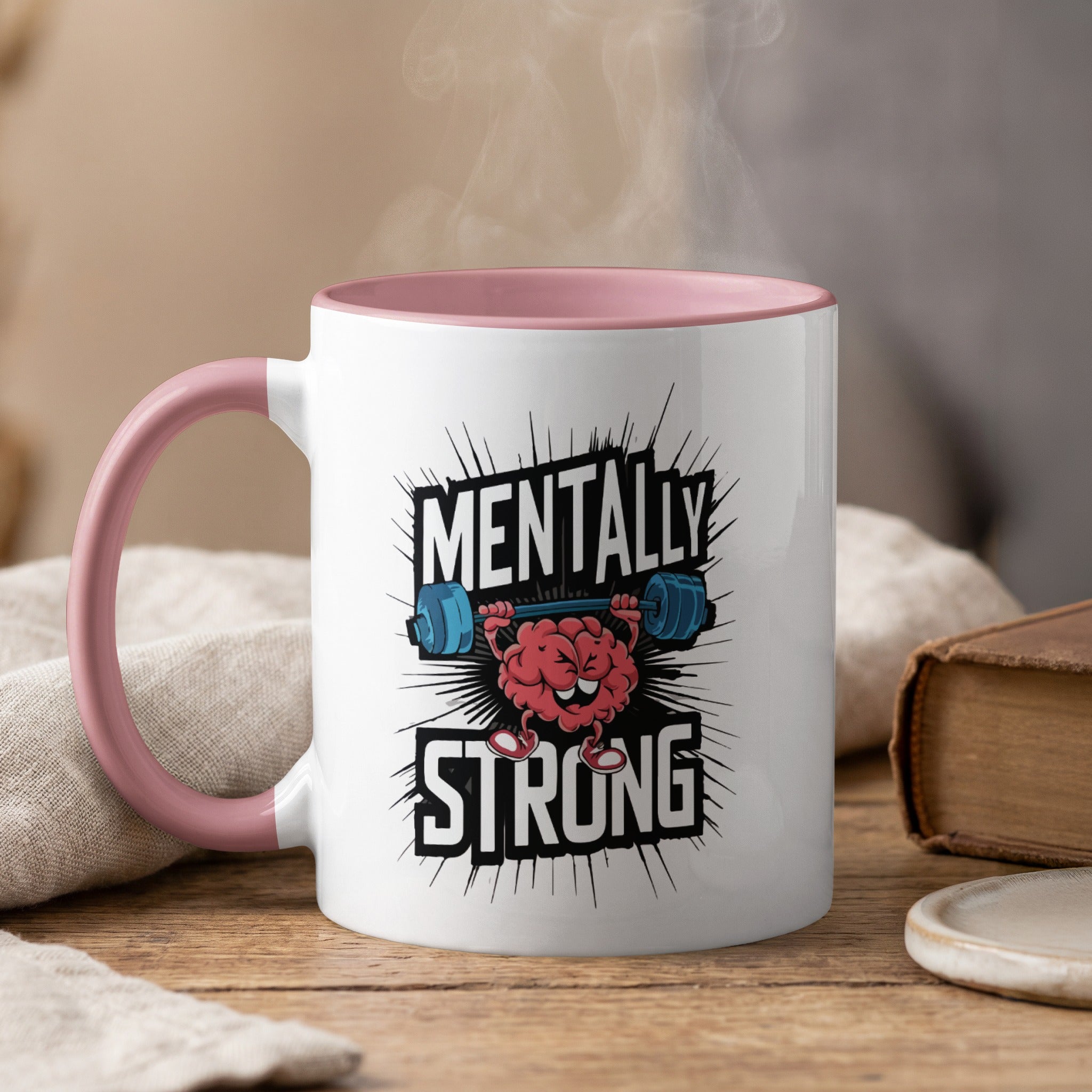 Mug with pink handle, featuring "Mentally Strong" text and a cartoon brain lifting a dumbbell.