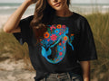 Black t-shirt with a blue floral mermaid design.