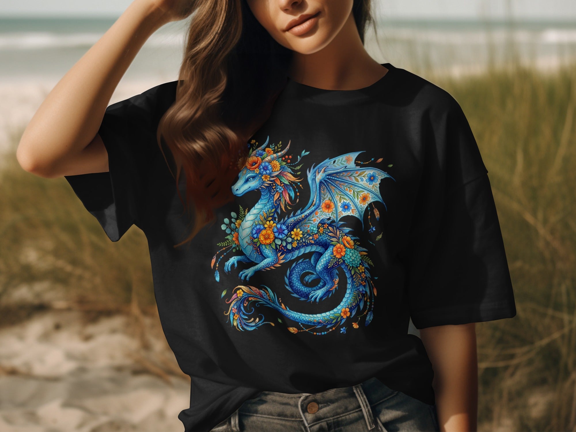 Black t-shirt with a blue dragon adorned with colorful flowers and feathers.